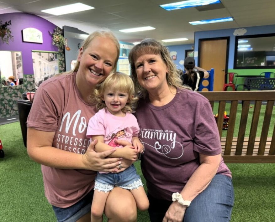 Grammy with her daughter and granddaughter on main street at Grammy's Town