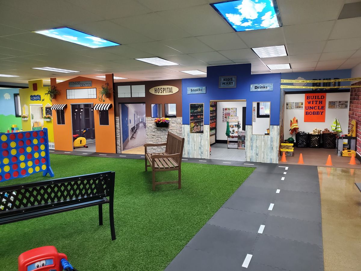 Main street with the school, fitness center, hospital, Kids Mart and construction site